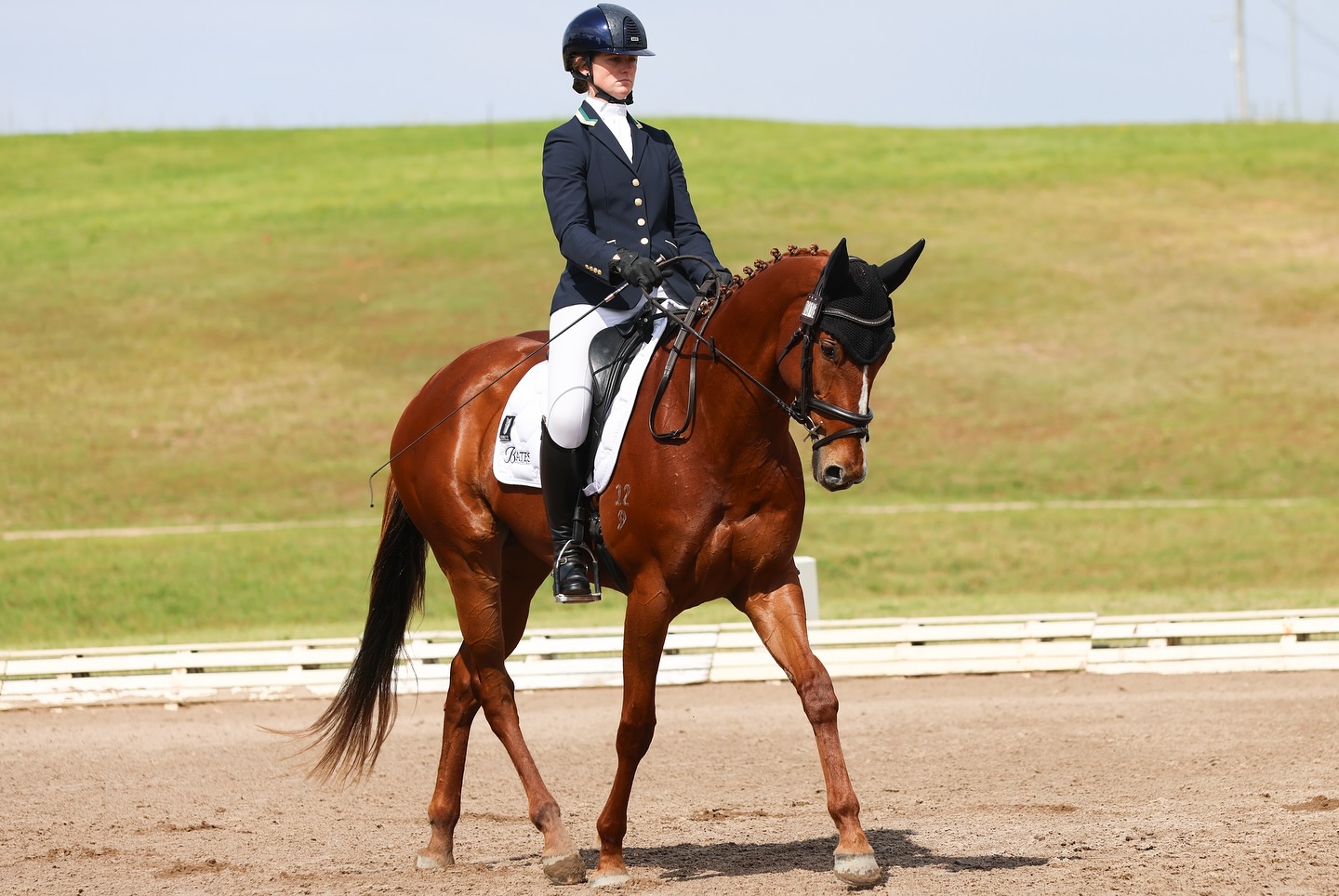 Hazel Shannon riding a horse in dressage work
